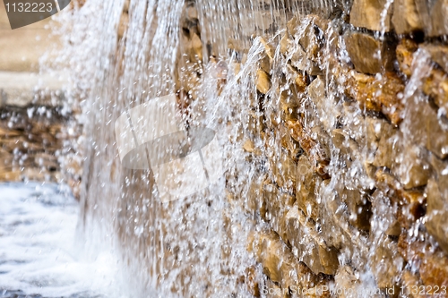 Image of Fresh water falling down on rocks