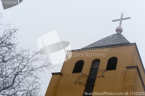Image of Church in the fog with star and cross