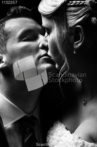 Image of Beautiful couple kissing in black and white