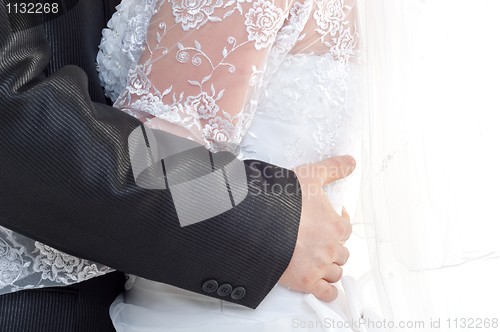 Image of Married couple holding tight togather