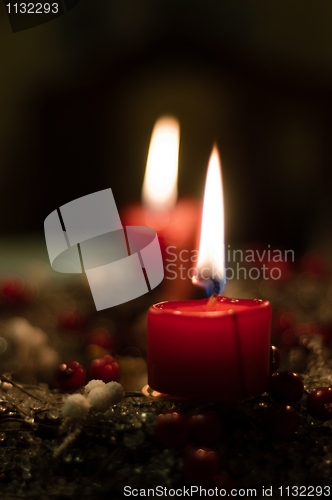 Image of Christmas candles on girlde with blurry background