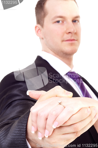Image of Bride and groom holding hand