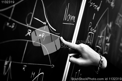 Image of Pointing on chalk board in black and white