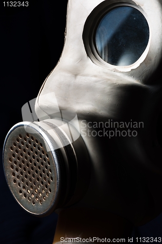 Image of Dark gasmask on enlighted background