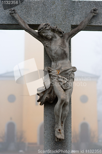 Image of Stone cross with Jesus Christ crucifixion