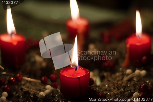 Image of Christmas candles on girlde with blurry background