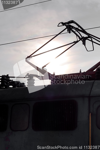 Image of Old train with electric cables closeup