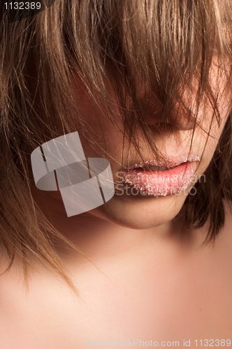 Image of Closeup of a girl with sugar on her lips