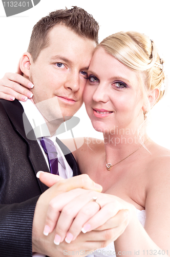 Image of Bride and groom holding hand