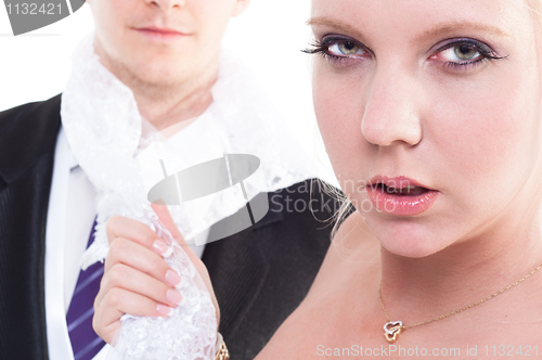 Image of Bride holding her husband on leash