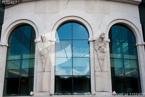 Image of Modern windows with statues