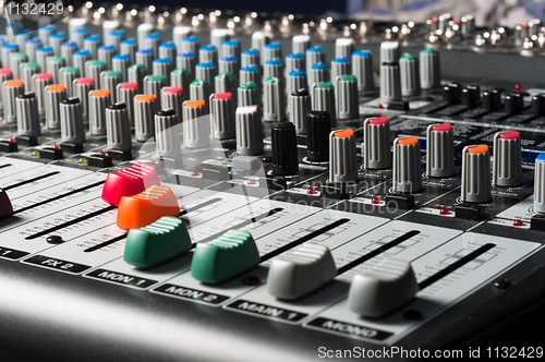 Image of Studio mixer with sliders and buttons