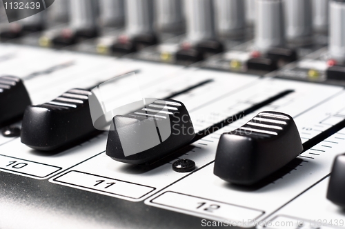 Image of Part of an audio sound mixer with buttons