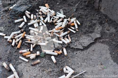 Image of Pile of cigarettes on ground