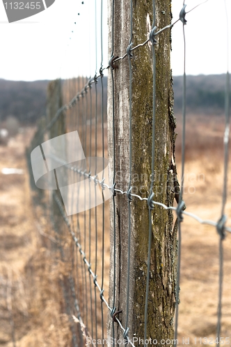 Image of Wooden fence with metal net