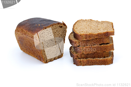 Image of Half of rye bread with anise and some slices