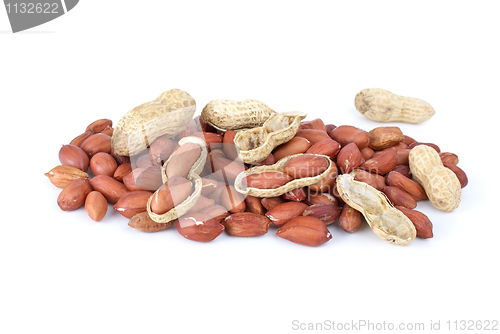 Image of Some whole, shelled roasted peanuts and husk