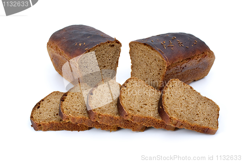 Image of Two halves of rye bread with anise and some slices