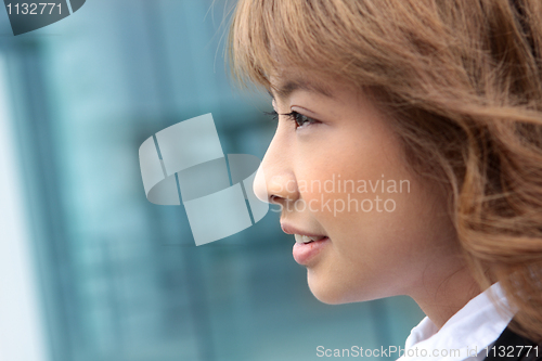 Image of Happy successful young business people standing side at office l