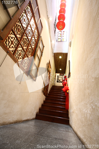 Image of Chinese traditional corridor in wooden with red lantern.