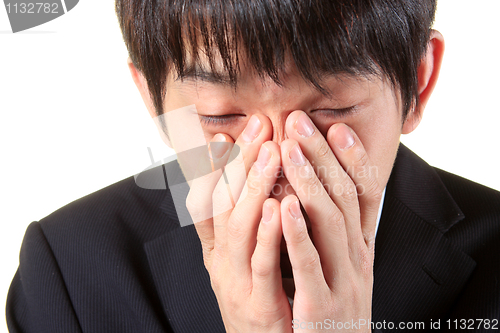 Image of young man with tired, indifferent expression 