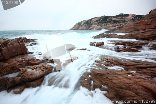 Image of Beautiful seascape. Sea and rock at the sunset. Nature compositi