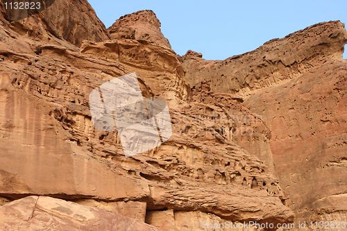 Image of Orange weathered rocks in desert