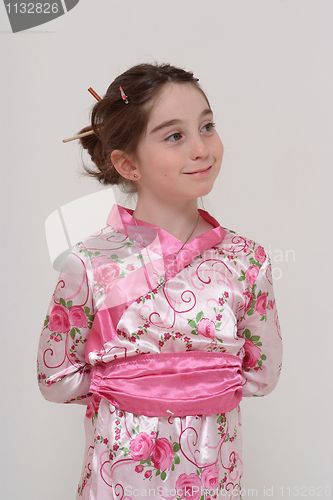 Image of Cute smiling girl in Japanese masquerade costume