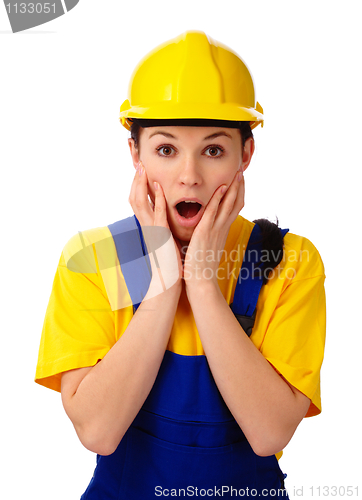 Image of Construction girl holding her face in astonishment