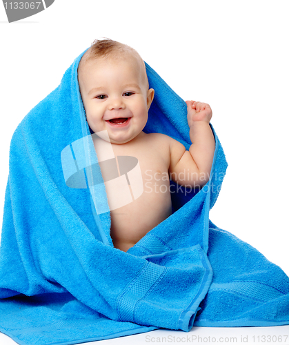 Image of Cute child wrapped in blue towel