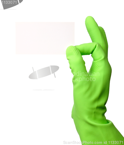 Image of Hand in green glove showing business card