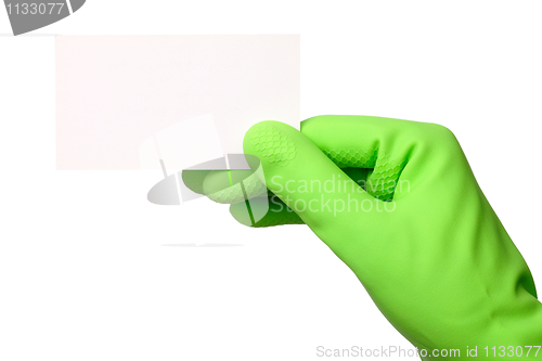 Image of Hand in green glove showing business card