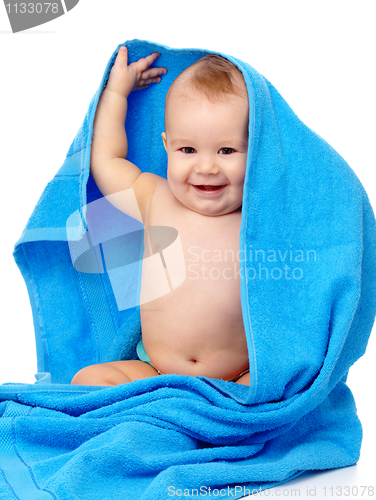 Image of Cute child wrapped in blue towel