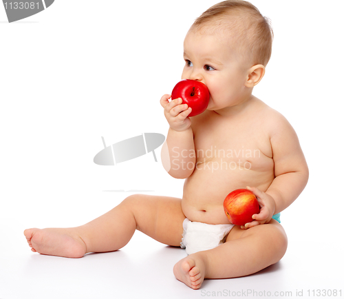 Image of Little child with apple