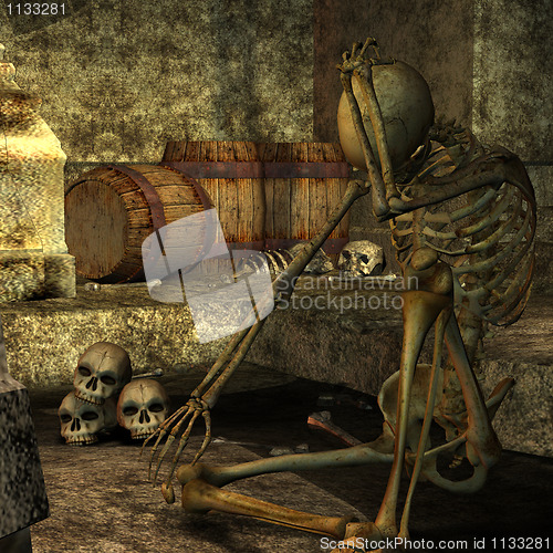 Image of skeleton sitting in the dungeon