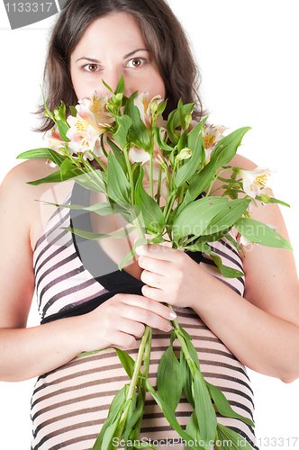 Image of Portrait of pretty pregnant woman with flowers