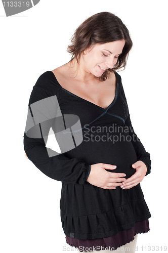 Image of Portrait of pretty pregnant woman in black dress