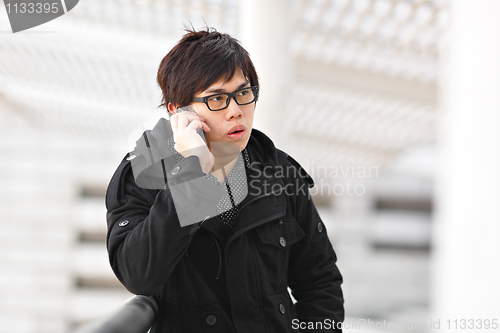 Image of man talking on mobile phone