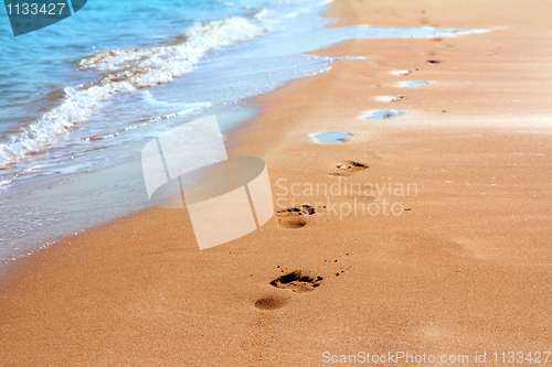 Image of footprints on sand beach