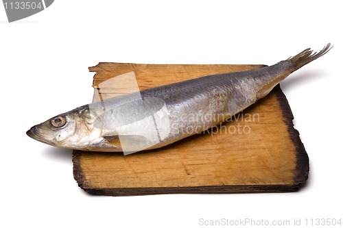 Image of Herring on old wooden board