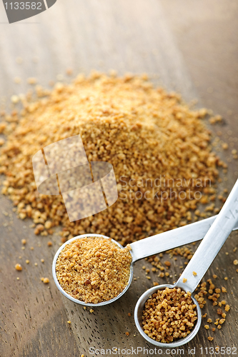 Image of Coconut palm sugar in measuring spoons