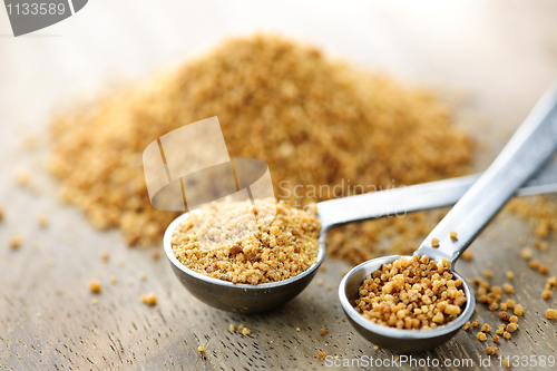 Image of Coconut palm sugar in measuring spoons