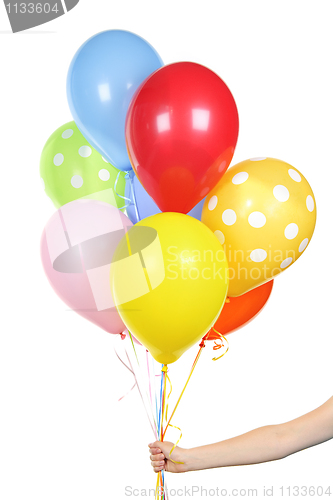 Image of Hand holding balloons on white