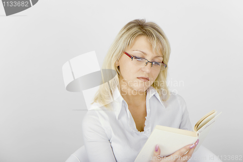 Image of girl reading a book