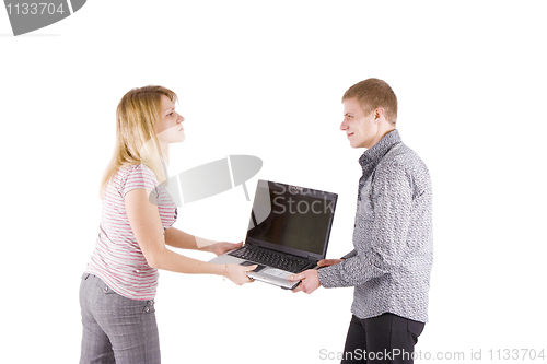 Image of man and woman fighting over laptop