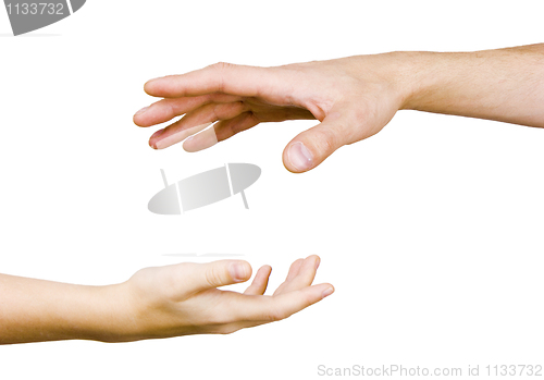 Image of child's hand reaches for the men's hand