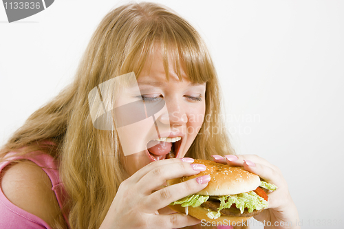 Image of Hungry blonde and hamburger