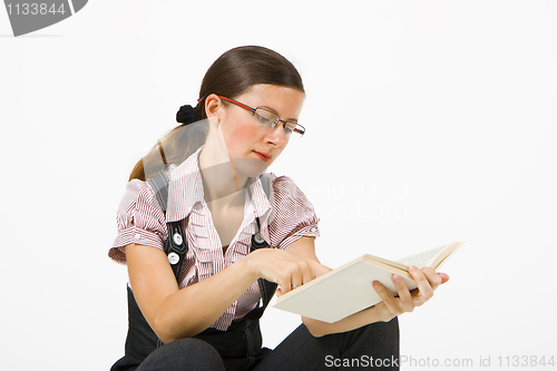 Image of clever girl reading a book