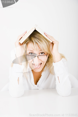 Image of she hid under a book