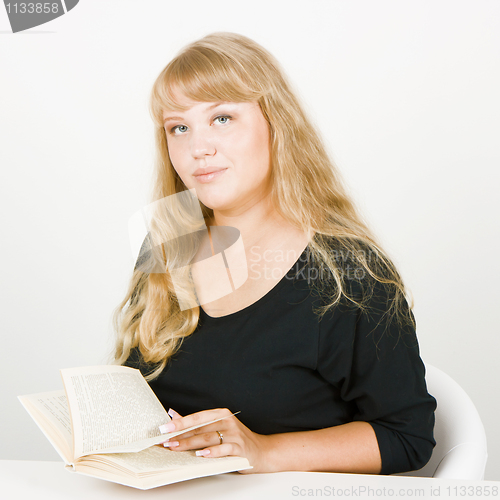 Image of blonde with a book